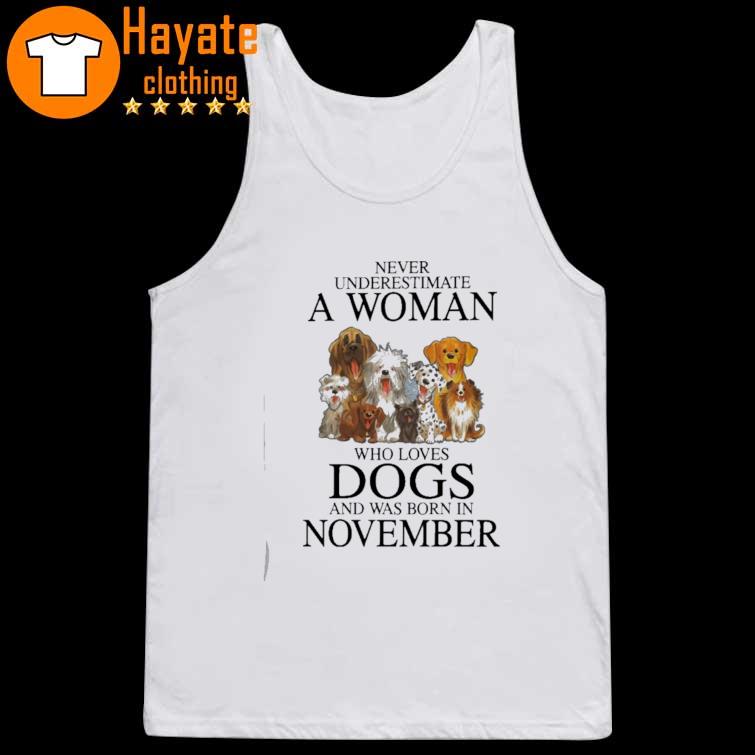 Never underestimate a Woman who loves Dogs and was born in November tank top